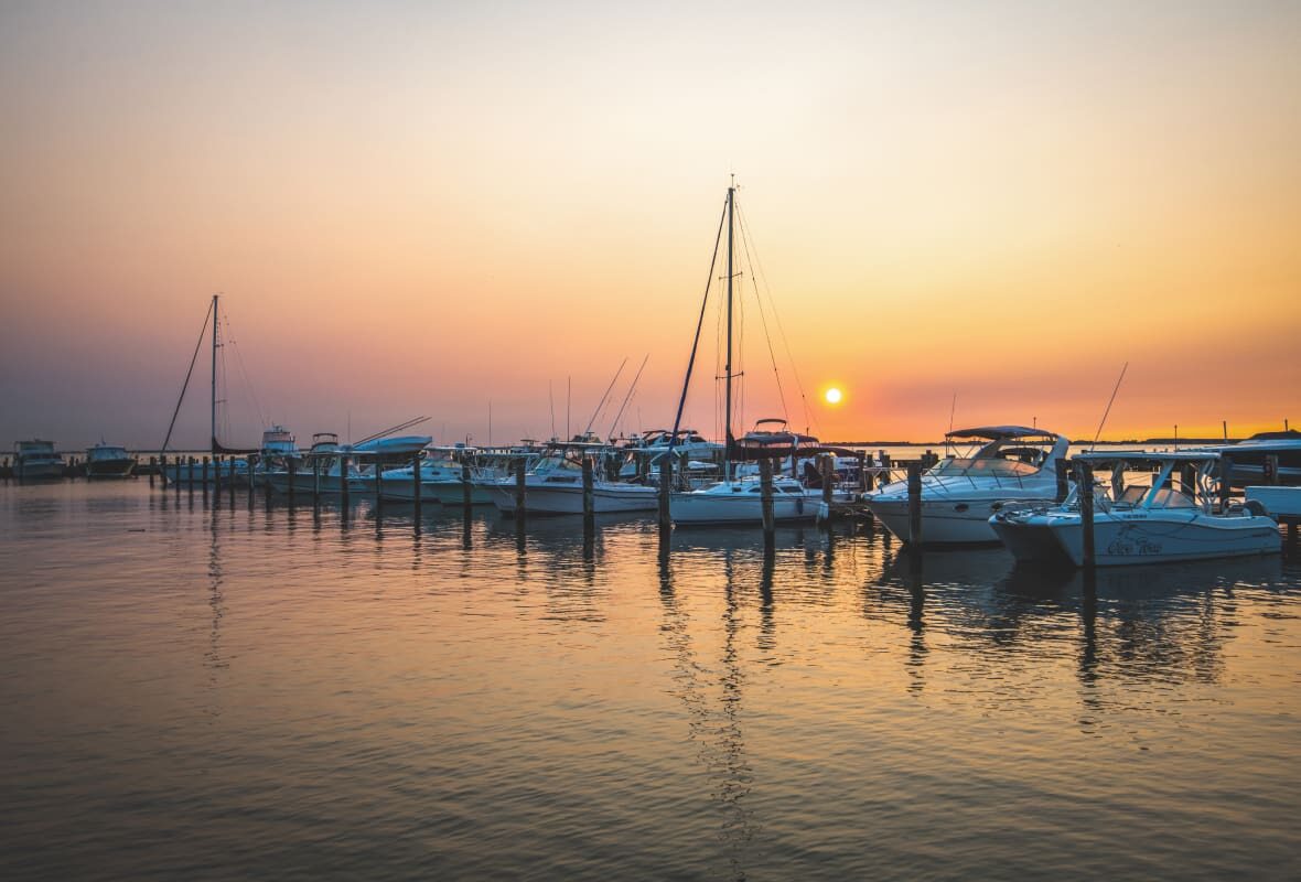 marina with a lot of boats at sunset