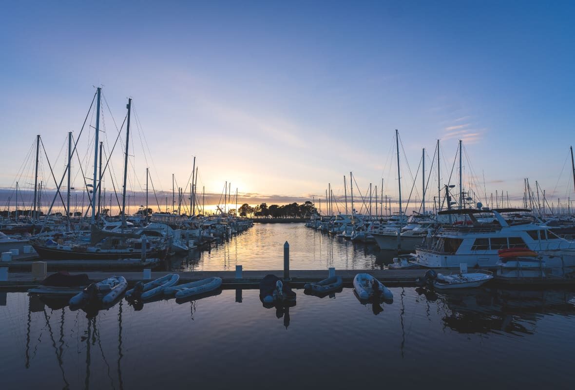 wide view of a marina at sunset