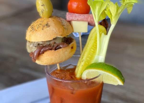 bloody mary drink with toppings on sticks