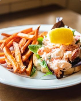seafood sandwich and fries