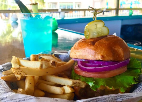 burger with fries and a blue drink