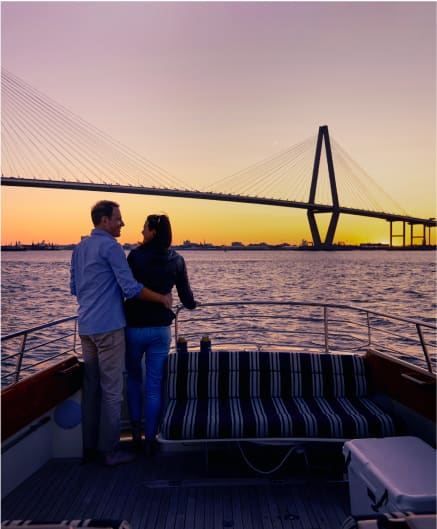 couple watching sunset on boat