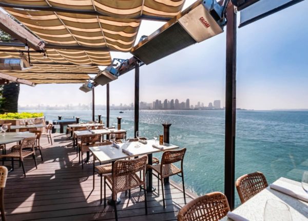 outdoor seating directly on the water with skyline