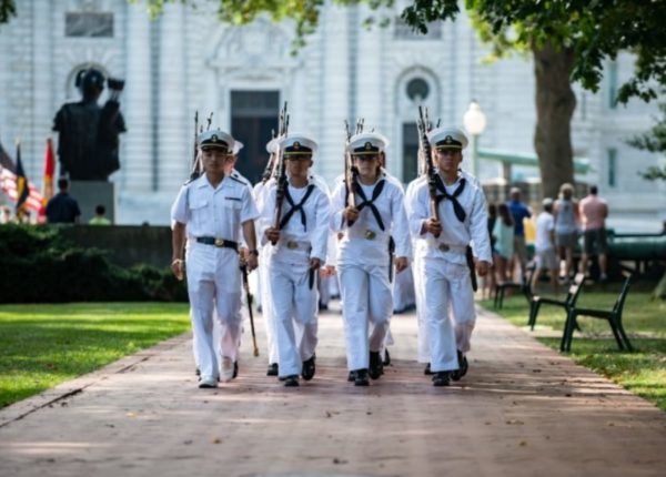 men marching in uniform
