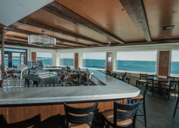 restaurant with bar and ocean view