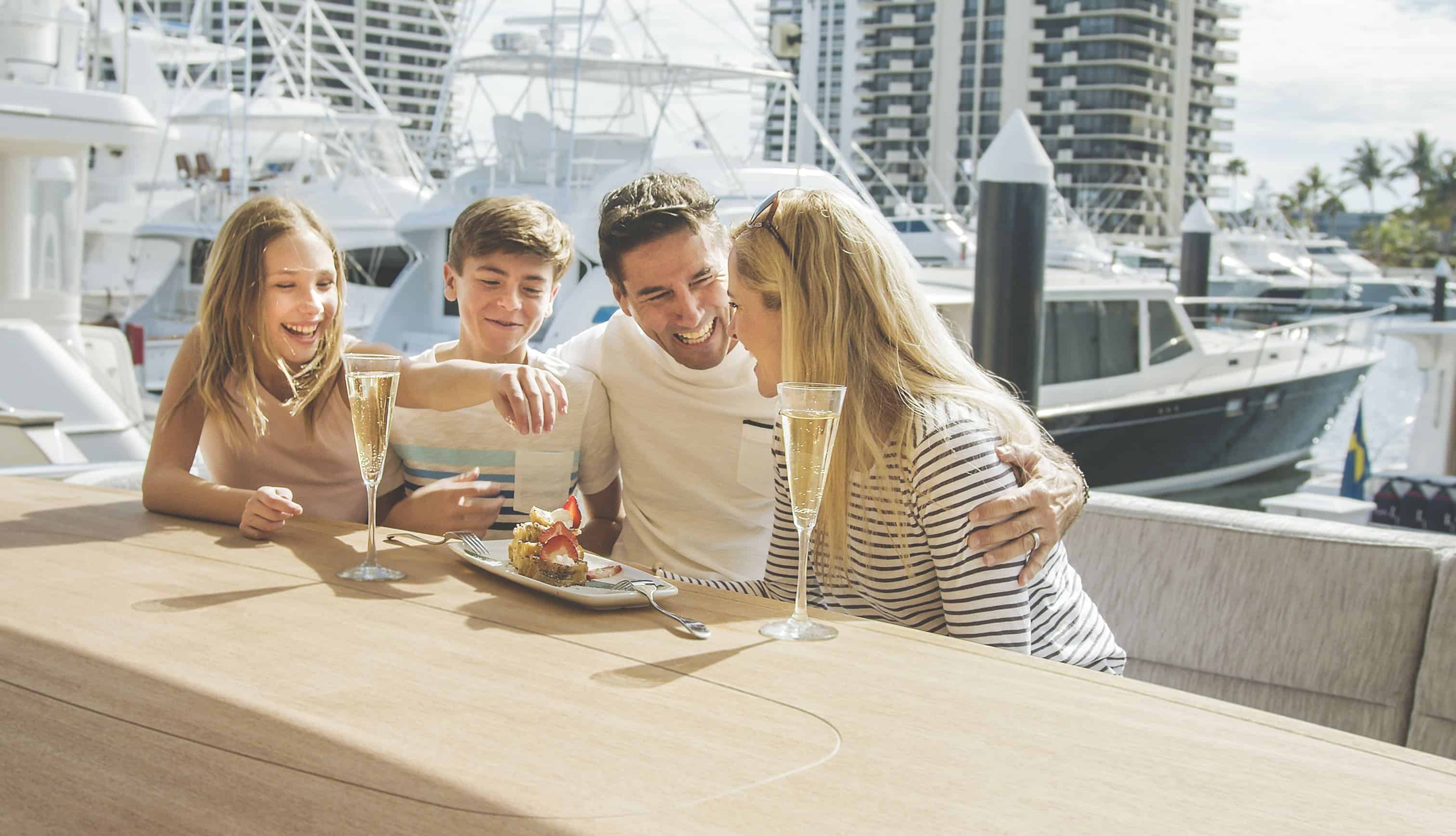 family smiling on boat