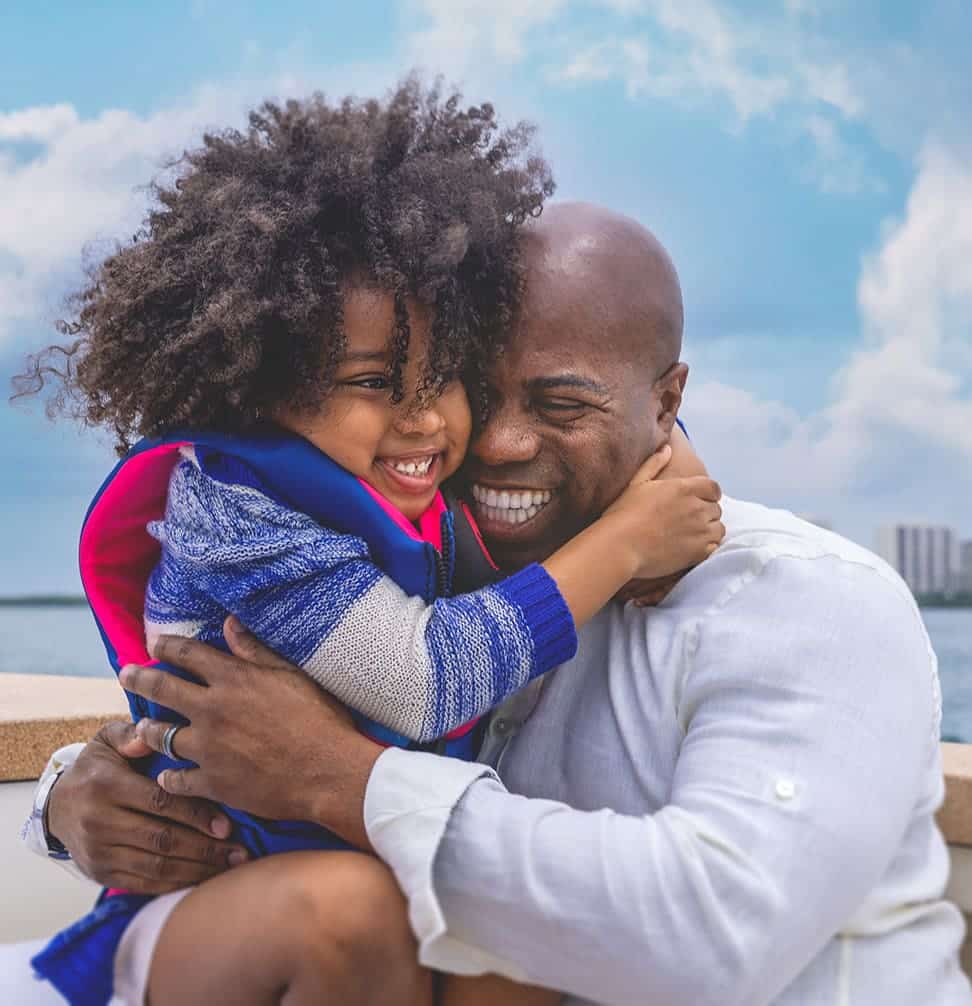 father and daughter smiling