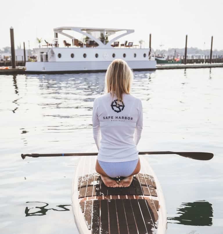 woman sitting on a paddleboard