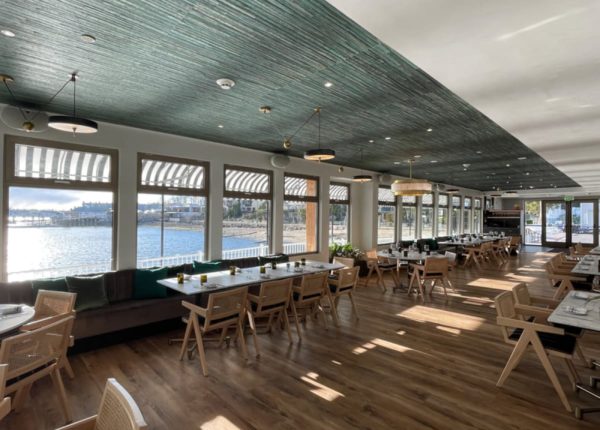 restaurant interior with windows that overlook the water