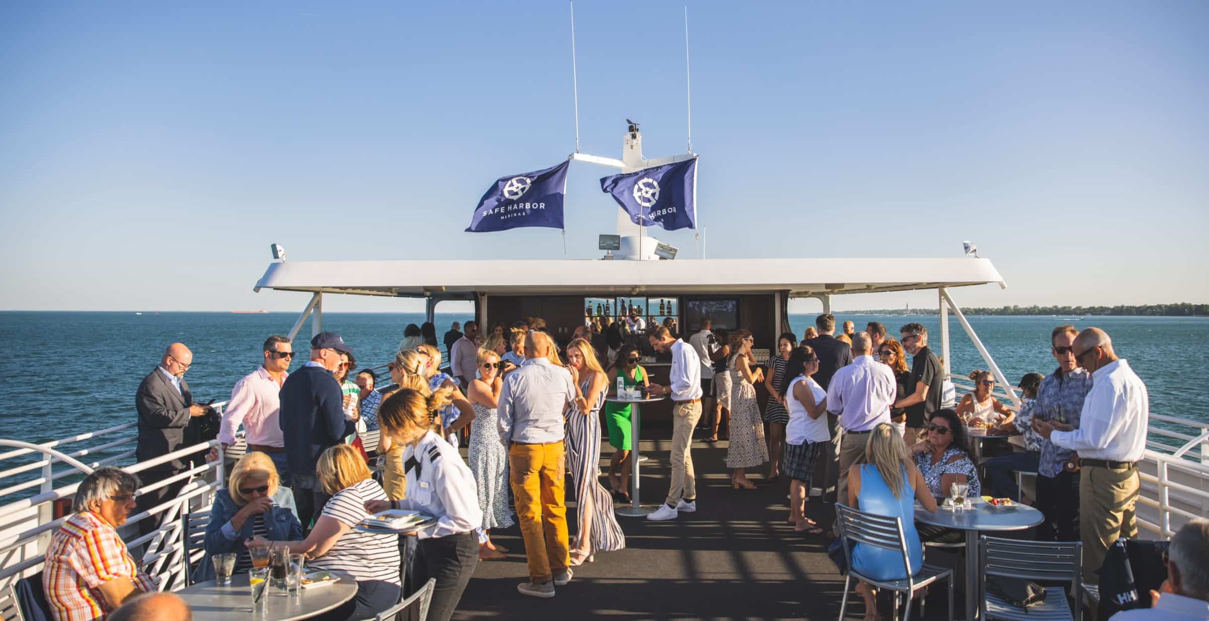 people on the top of a yacht for an event