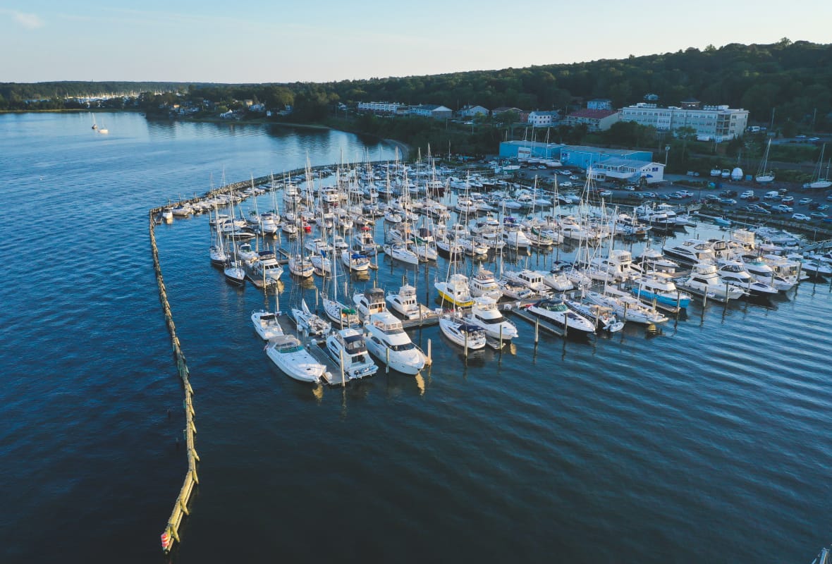 aerial view of safe harbor cowesett with many boats docked