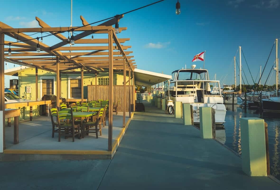 outdoor seating with an arbor at the marina