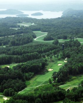 aerial view of golf course and lake